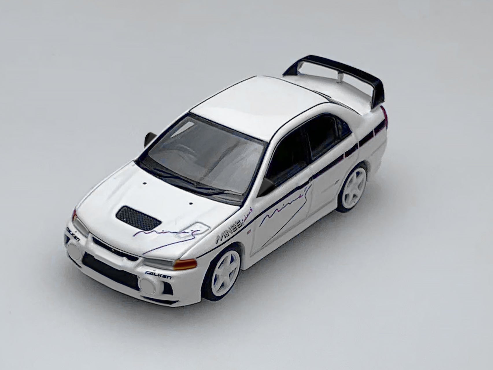 [MOTORHELIX] 1:64 Mitsubishi Lancer Evolution IV GSR Mine's Livery