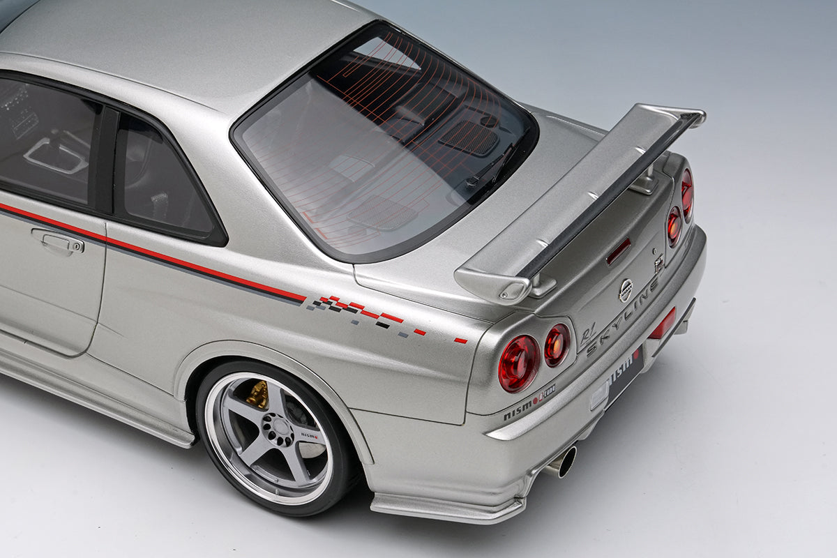 [MAKE UP] 1:18 Nissan Skyline GT-R (BNR34 NISMO R-Tune Version) 2004 Silver / NISMO Stripe [EML135A]