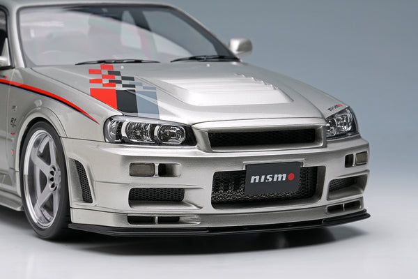 [MAKE UP] 1:18 Nissan Skyline GT-R (BNR34 NISMO R-Tune Version) 2004 Silver / NISMO Stripe [EML135A]